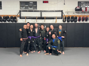 Foxhole board member John Gist (3rd from left), Phillip Lucut who recently enlisted (second from left) and Russ Powledge, Army officer veteran (fourth from left) all earned promotions to purple belt. Congratulations guys!